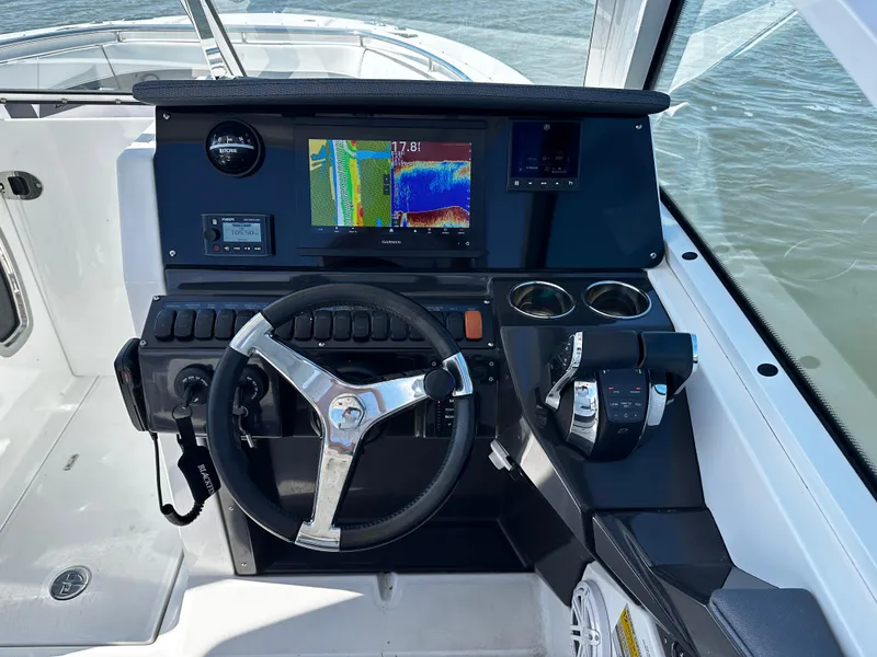 Slide: The Image of 2021 Blackfin 252 DC boat helm with navigation system and controls. - 12