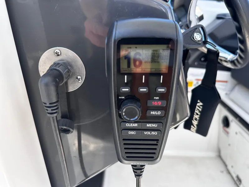 Slide: The Image of VHF radio on a 2021 Blackfin 252 DC boat dashboard. - 15