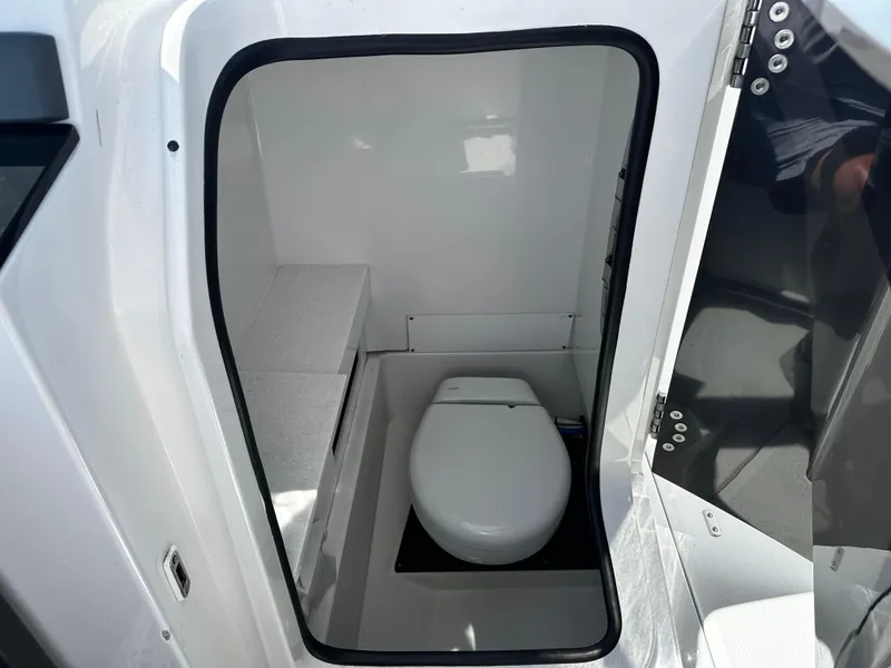 Slide: The Image of 2021 Blackfin 252 DC boat interior bathroom with toilet. - 18