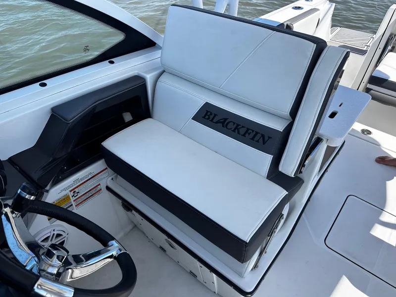 Slide: The Image of 2021 Blackfin 252 DC boat interior with white and black seating. - 20