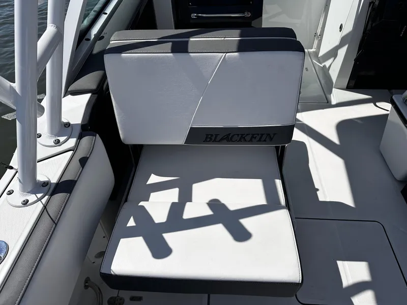 Slide: The Image of 2021 Blackfin 252 DC boat seat with logo, white and black upholstery. - 22
