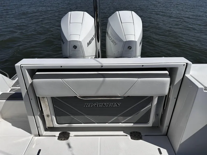Slide: The Image of 2021 Blackfin 252 DC boat with twin Mercury engines on water. - 24