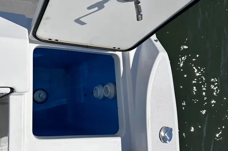 Slide: The Image of Open storage compartment on a 2021 Blackfin 252 DC boat. - 32