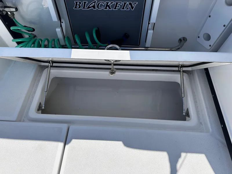 Slide: The Image of Open storage compartment on a 2021 Blackfin 252 DC boat. - 34
