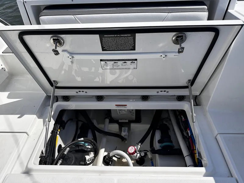 Slide: The Image of 2021 Blackfin 252 DC boat engine compartment with open hatch. - 35