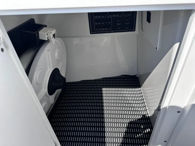 Slide: The Image of 2021 Blackfin 252 DC storage compartment with equipment and control panel. - 36