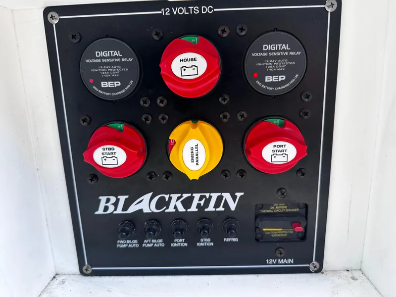 Slide: The Image of 2021 Blackfin 252 DC control panel with digital voltage sensitive relays and battery switches. - 37