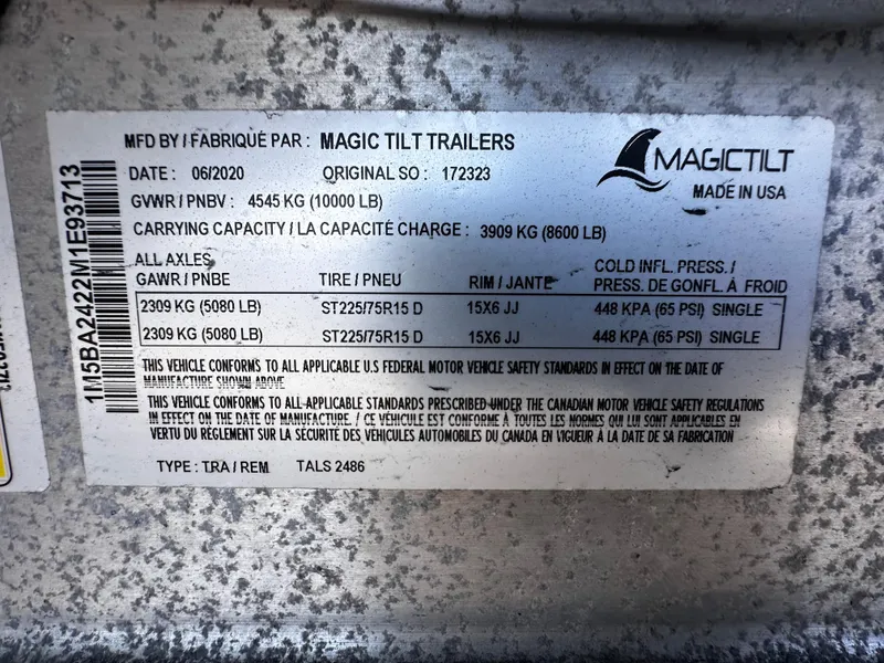 Slide: The Image of Magic Tilt Trailers label with specifications and safety standards, dated 06/2020. - 41