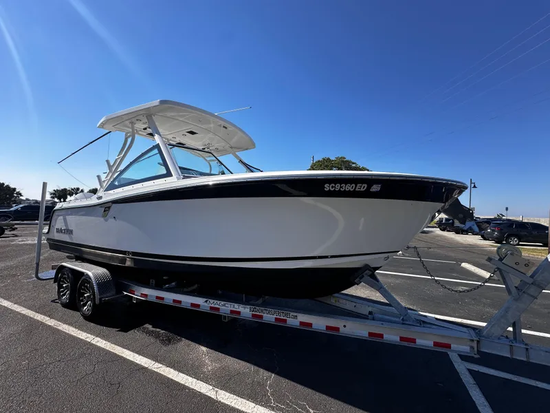 Slide: The Image of 2021 Blackfin 252 DC boat on a trailer in a parking lot. - 5
