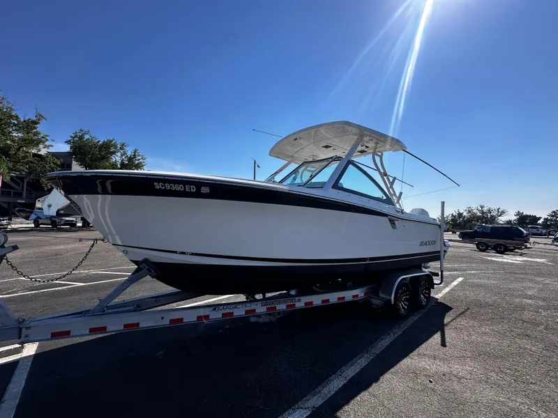 Slide: The Image of 2021 Blackfin 252 DC boat on a trailer in a parking lot. - 6