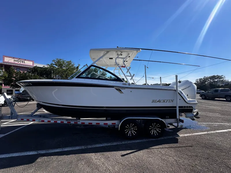 Slide: The Image of 2021 Blackfin 252 DC boat on a trailer in a parking lot. - 7
