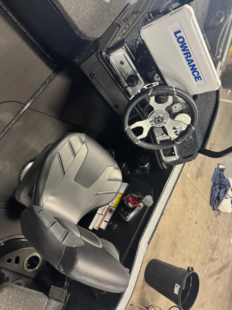 Slide: The Image of 2024 Nitro ZV20 Pro boat cockpit with Lowrance system and sleek steering wheel. - 12