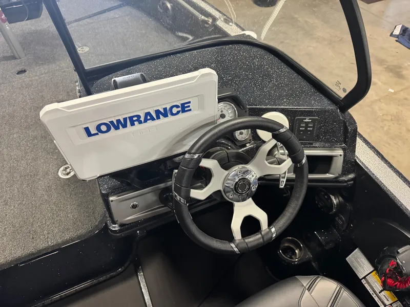 Slide: The Image of 2024 Nitro ZV20 Pro boat dashboard with Lowrance display and steering wheel. - 13