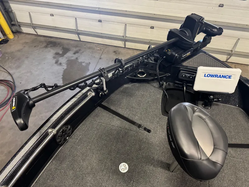 Slide: The Image of 2024 Nitro ZV20 Pro boat interior with Lowrance electronics and trolling motor. - 17