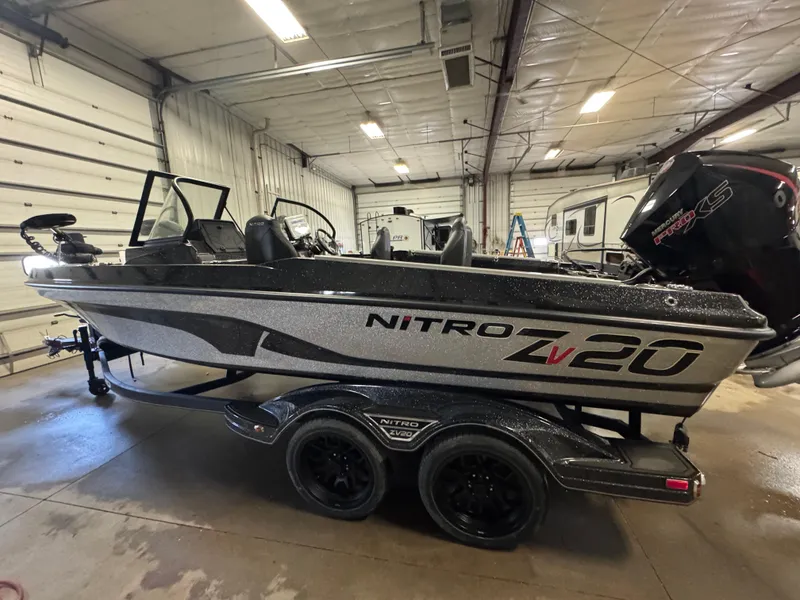 Slide: The Image of 2024 Nitro ZV20 Pro boat in a garage, showcasing sleek design and powerful engine. - 5