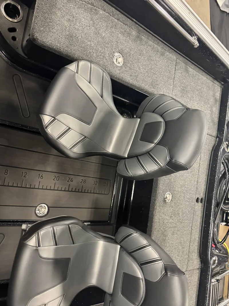 Slide: The Image of 2024 Nitro ZV20 Pro boat interior with sleek black seats and measurement markings. - 7