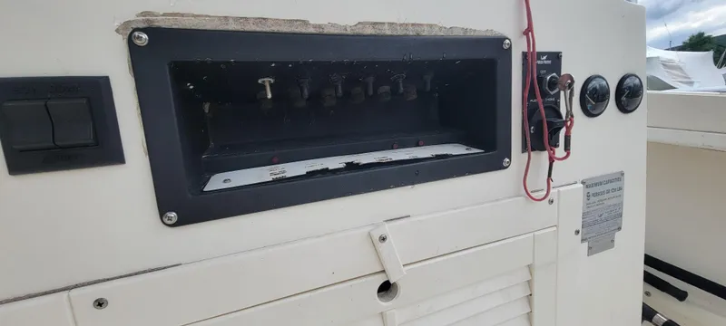 Slide: The Image of Control panel of a 1996 Mako 22 Center Console boat with switches and gauges. - 20