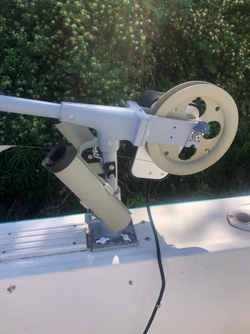 Slide: The Image of Fishing rod holder and reel on a 1996 Mako 22 Center Console boat. - 25