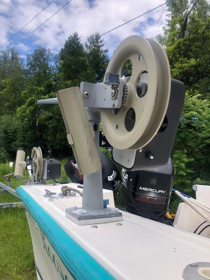 Slide: The Image of Close-up of a 1996 Mako 22 Center Console boat with Mercury engine. - 28