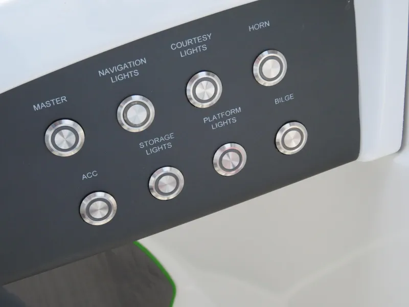 Slide: The Image of Control panel of a 2022 Tahoe 210 S Limited boat with various function buttons. - 11