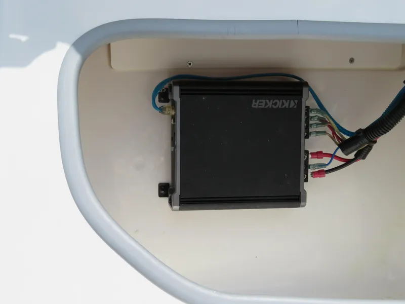 Slide: The Image of Kicker amplifier installed in a 2022 Tahoe 210 S Limited boat. - 16