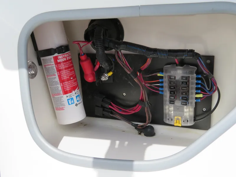 Slide: The Image of Electrical panel and fire extinguisher in 2022 Tahoe 210 S Limited boat. - 17