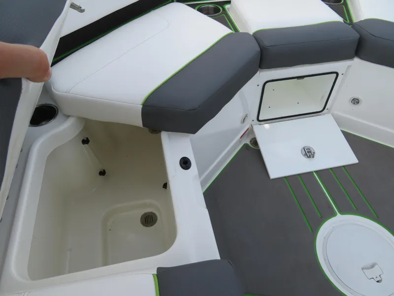 Slide: The Image of 2022 Tahoe 210 S Limited boat interior with storage compartments and seating. - 19