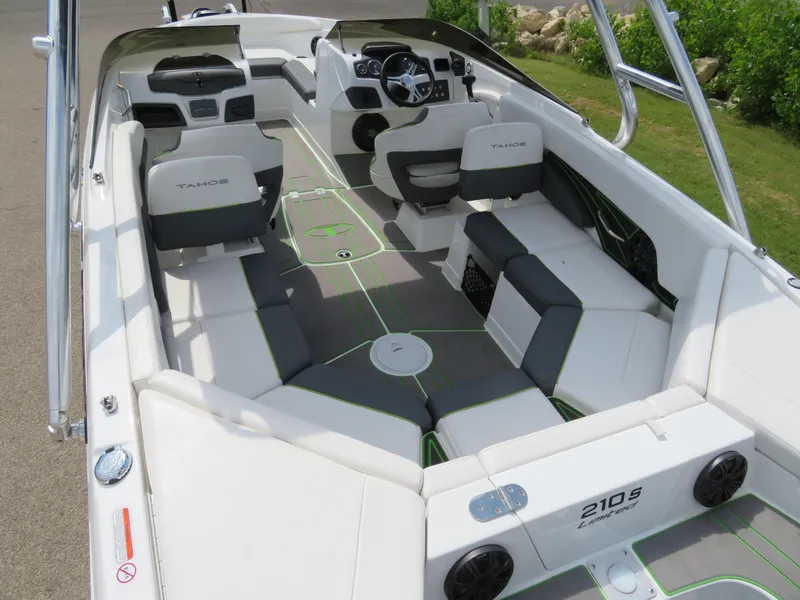 Slide: The Image of 2022 Tahoe 210 S Limited boat interior with seating and dashboard. - 6