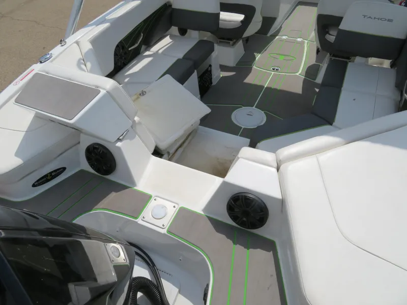 Slide: The Image of 2022 Tahoe 210 S Limited boat interior with seating and storage compartments. - 7