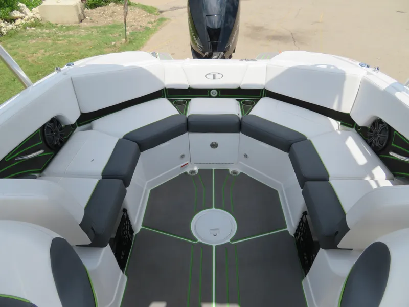 Slide: The Image of 2022 Tahoe 210 S Limited boat interior with white and black seating. - 8