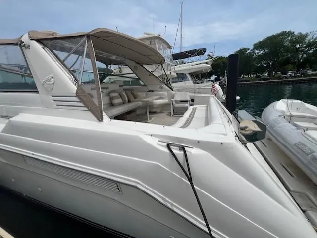 Slide: The Image of 1992 Sea Ray Sundancer yacht docked at marina. - 15