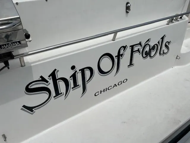 Slide: The Image of 1992 Sea Ray Sundancer boat named Ship Of Fools docked in Chicago. - 17