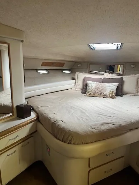 Slide: The Image of Luxurious bedroom interior of a 1992 Sea Ray Sundancer yacht. - 23