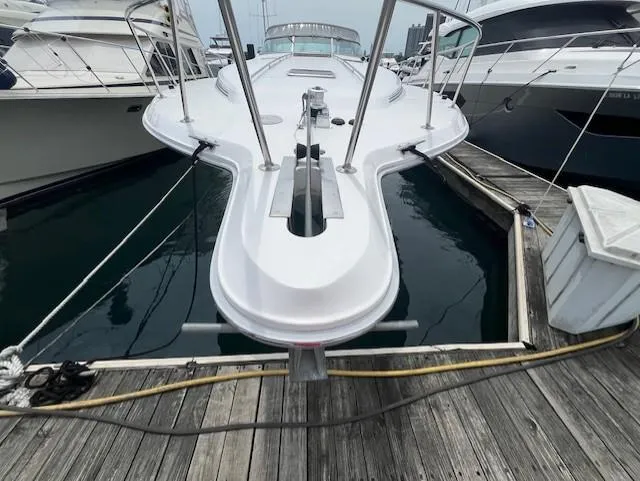 Slide: The Image of 1992 Sea Ray Sundancer docked at a marina, front view. - 6