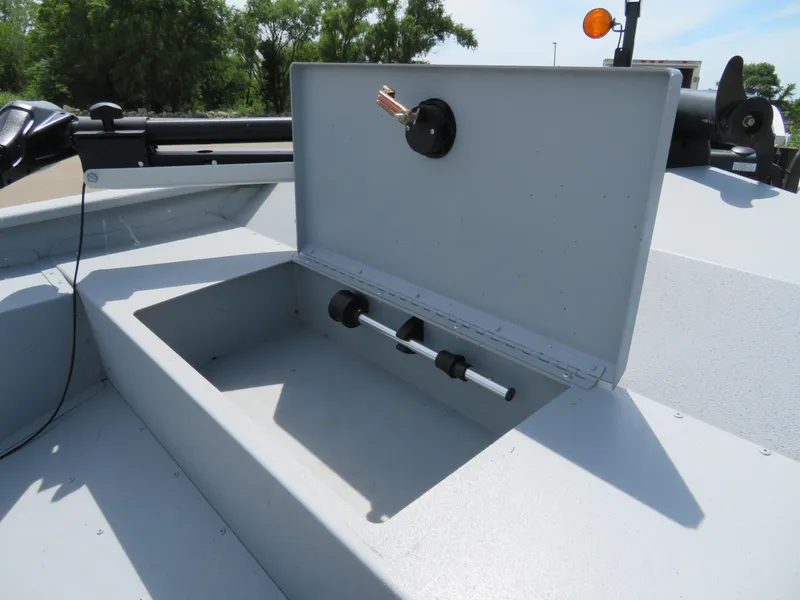Slide: The Image of 2023 G3 Sportsman 1610 SS boat storage compartment with open lid. - 13