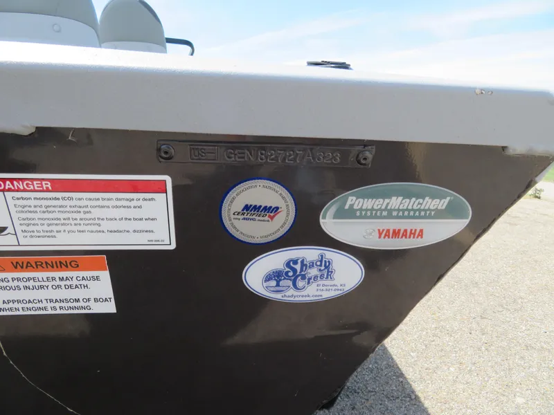 Slide: The Image of 2023 G3 Sportsman 1610 SS boat with warning labels and certification stickers. - 9