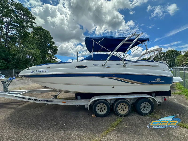 The Image of 2006 Chaparral Sunesta 236 boat on a trailer with blue canopy. - 0
