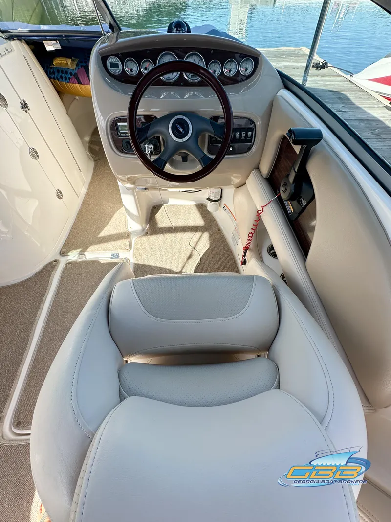 Slide: The Image of 2006 Chaparral Sunesta 236 boat cockpit with steering wheel and dashboard. - 14