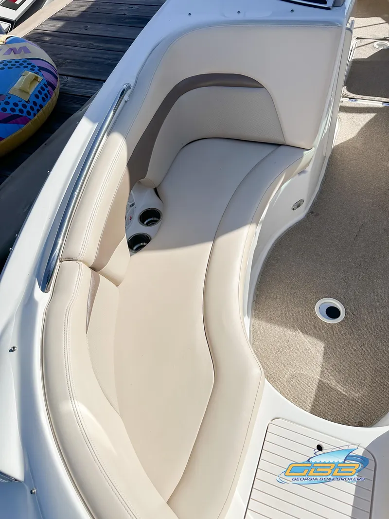 Slide: The Image of 2006 Chaparral Sunesta 236 boat interior seating with cup holders. - 18
