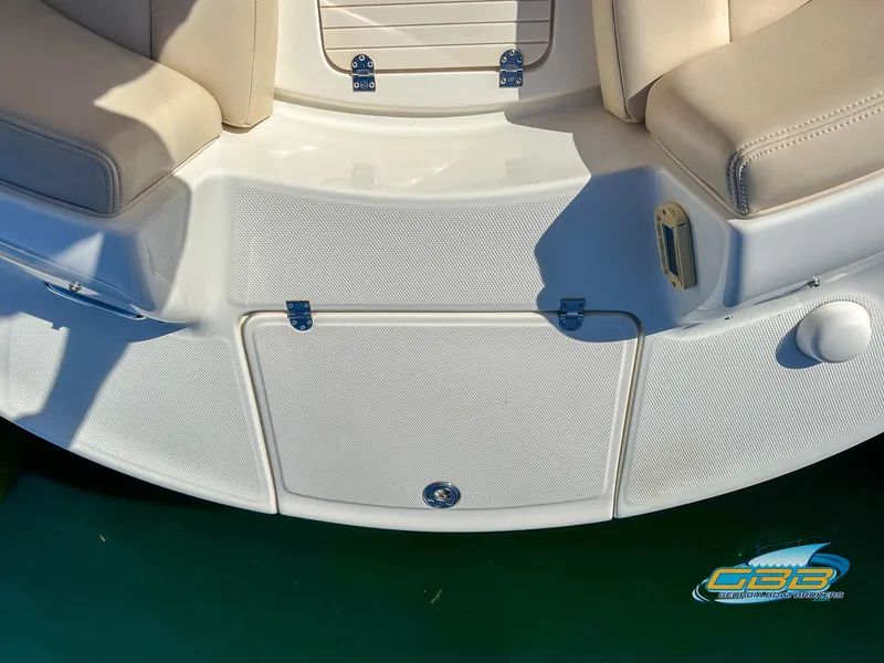 Slide: The Image of 2006 Chaparral Sunesta 236 boat seating and storage compartment. - 21