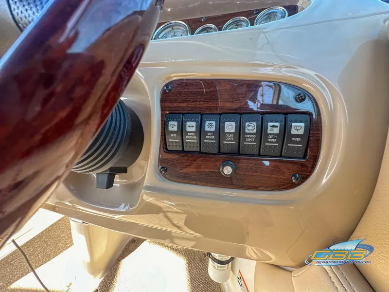 Slide: The Image of Dashboard controls of a 2006 Chaparral Sunesta 236 boat. - 26