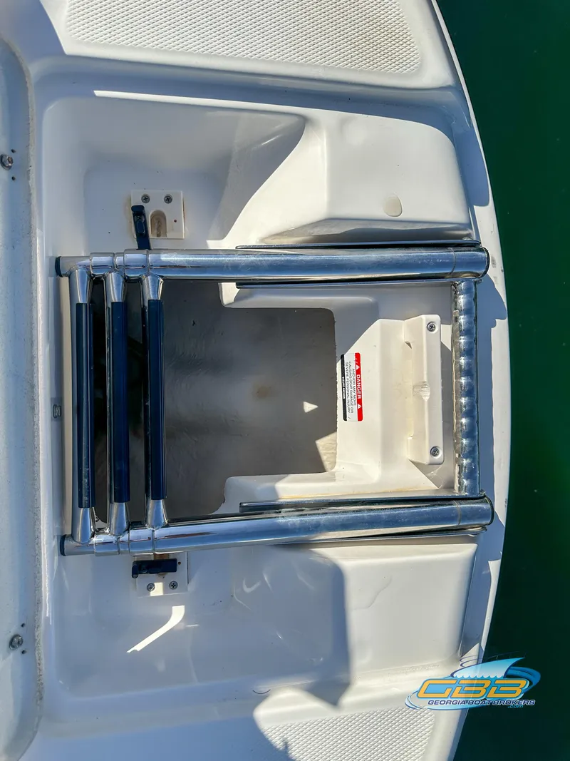 Slide: The Image of 2006 Chaparral Sunesta 236 swim platform with retractable ladder. - 27