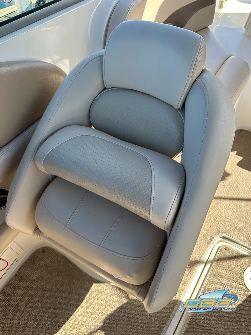 Slide: The Image of 2006 Chaparral Sunesta 236 boat seat with gray upholstery. - 29