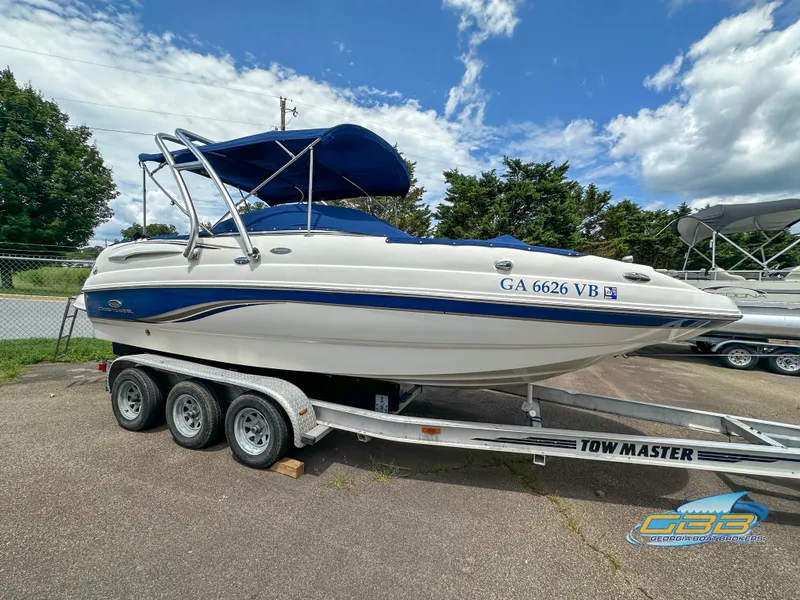 Slide: The Image of 2006 Chaparral Sunesta 236 boat on Tow Master trailer with blue canopy. - 3
