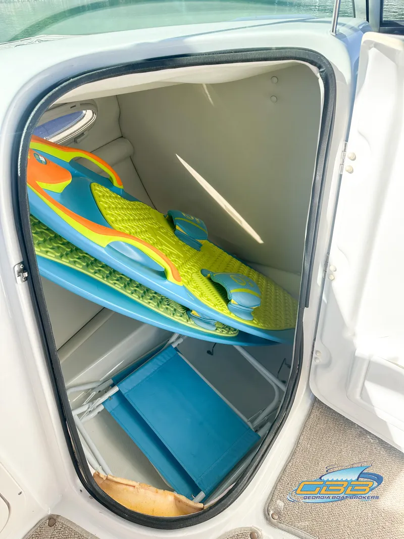 Slide: The Image of Storage compartment of a 2006 Chaparral Sunesta 236 boat with water sports equipment. - 37