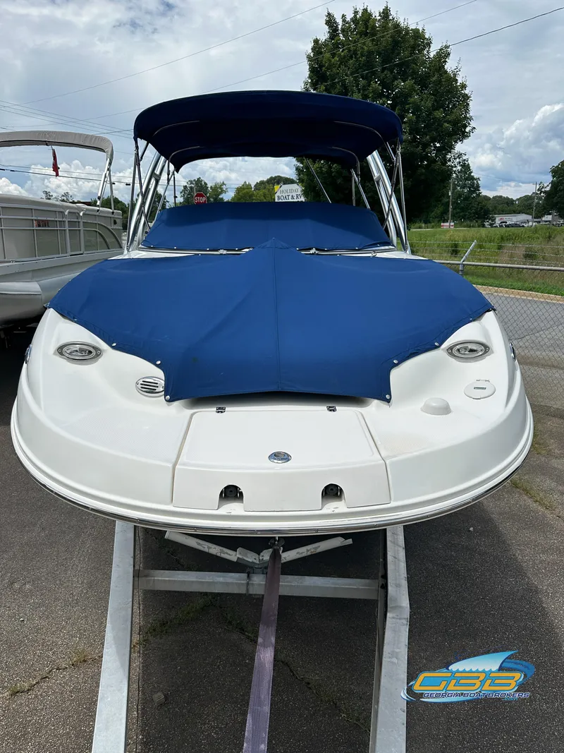 Slide: The Image of 2006 Chaparral Sunesta 236 boat with blue cover on trailer. - 4