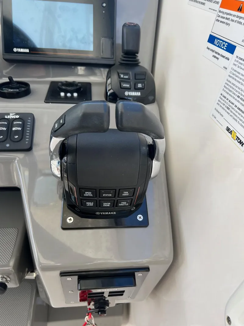 Slide: The Image of Close-up of the control panel on a 2017 Pursuit OS 355 Offshore boat. - 20