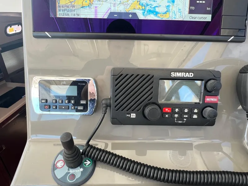 Slide: The Image of Control panel of a 2017 Pursuit OS 355 Offshore boat with Simrad electronics. - 21