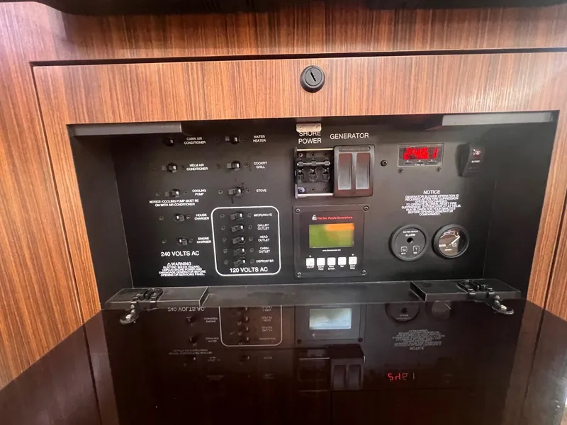 Slide: The Image of Control panel of a 2017 Pursuit OS 355 Offshore boat. - 32