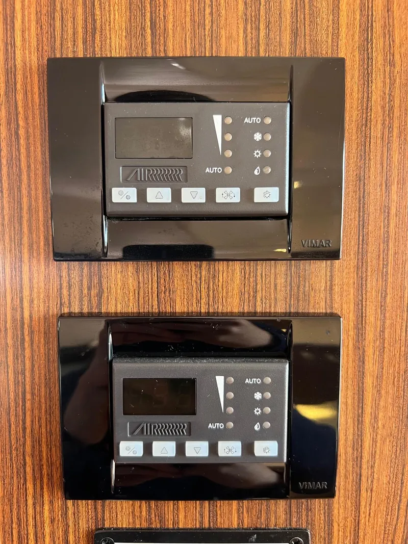 Slide: The Image of Control panels on a 2017 Pursuit OS 355 Offshore boat. - 33